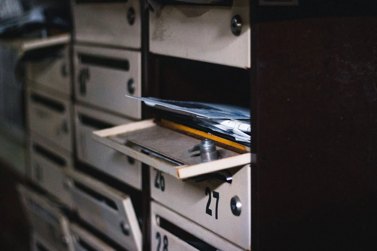 Open letterbox in a bank of letterboxes