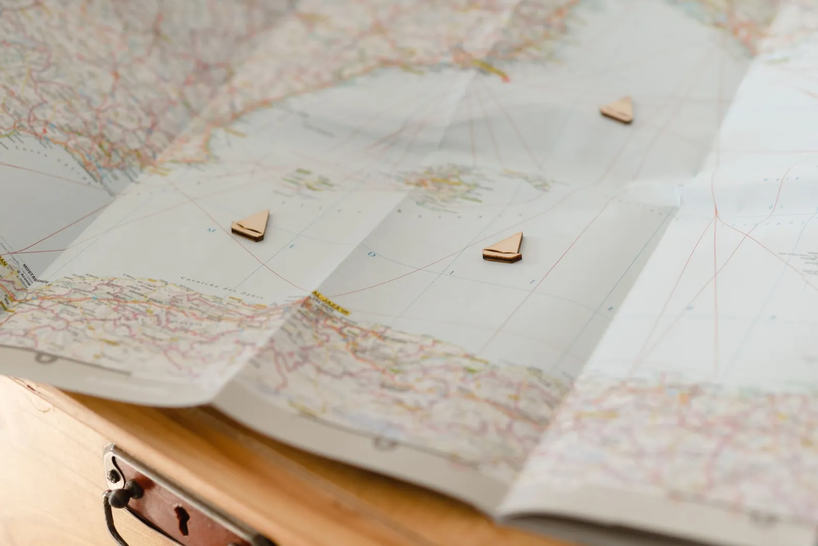 Open map with wooden markers